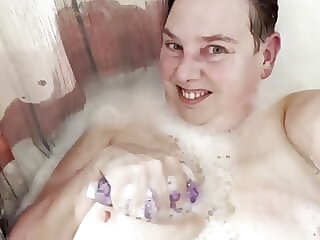 washing boobies in bath